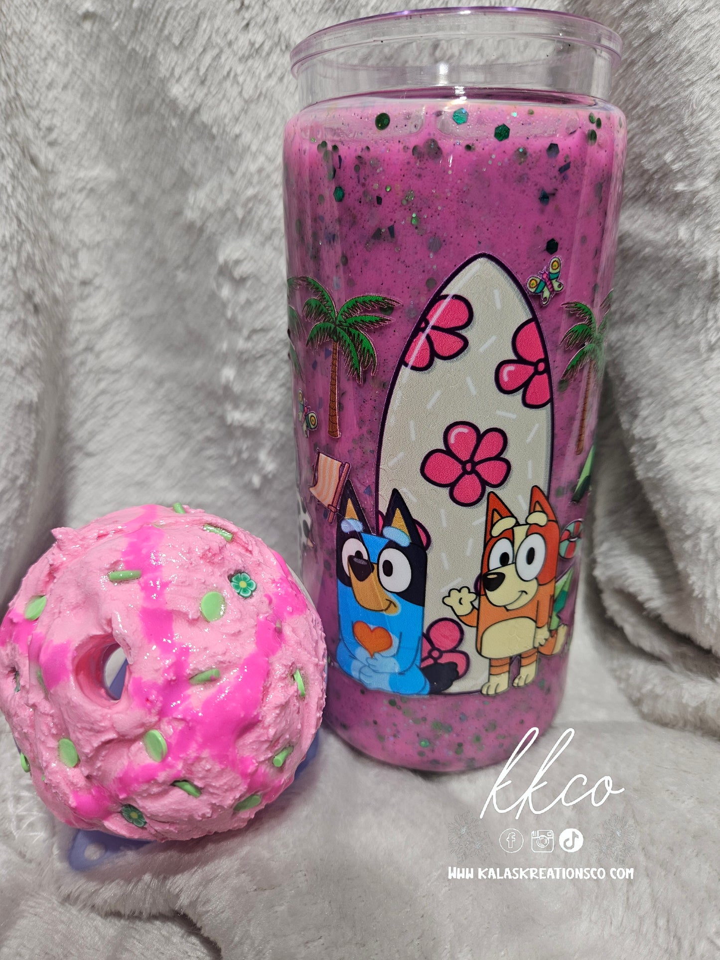20oz blue dog on a pink and green snow globe glitter tumbler with ice cream scoop lid